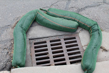 Curb barrier around a street drain at a construction site in Spring Hill, FL.